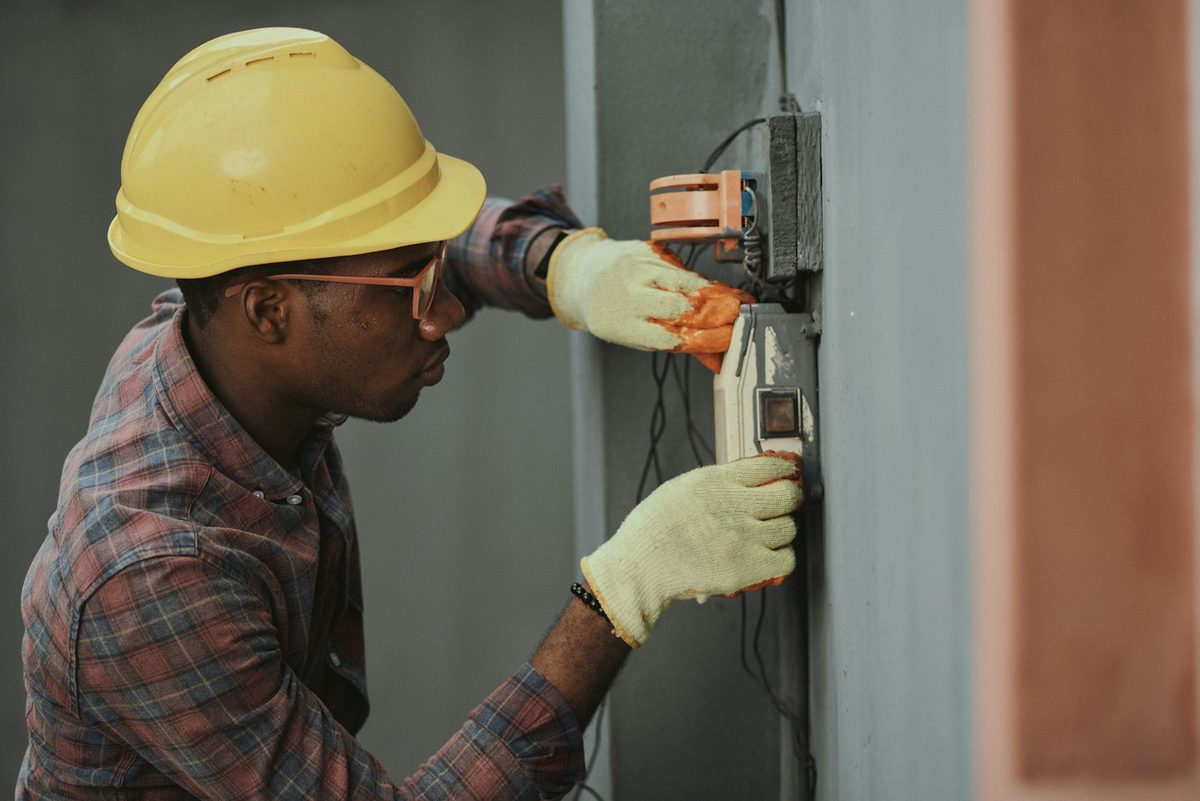 Illustrative stock photograph of an electrical worker; not a Guildford employee or customer job.